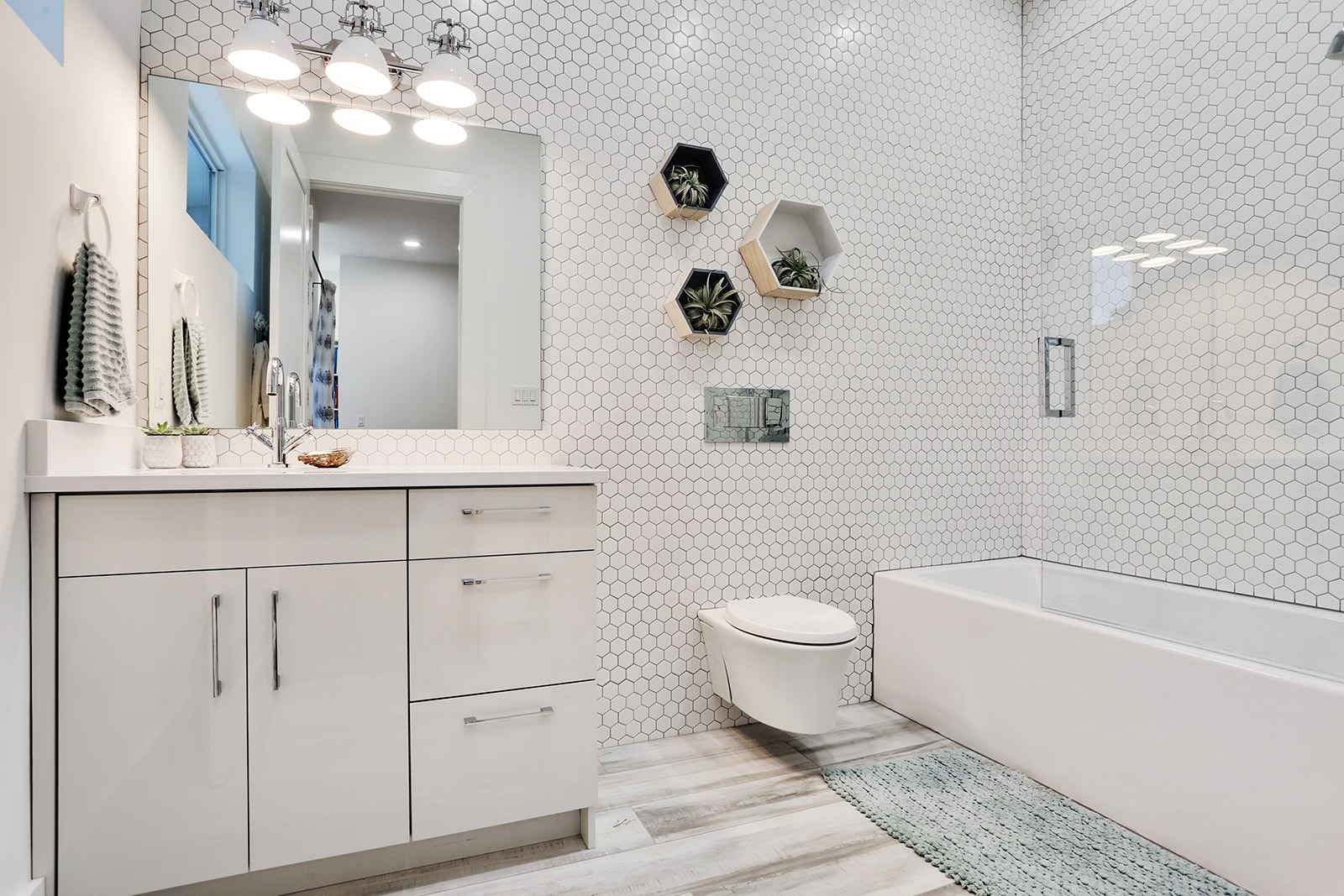 Bathroom of Elmeer House luxury new construction custom home designed and built by DMG Design+Build