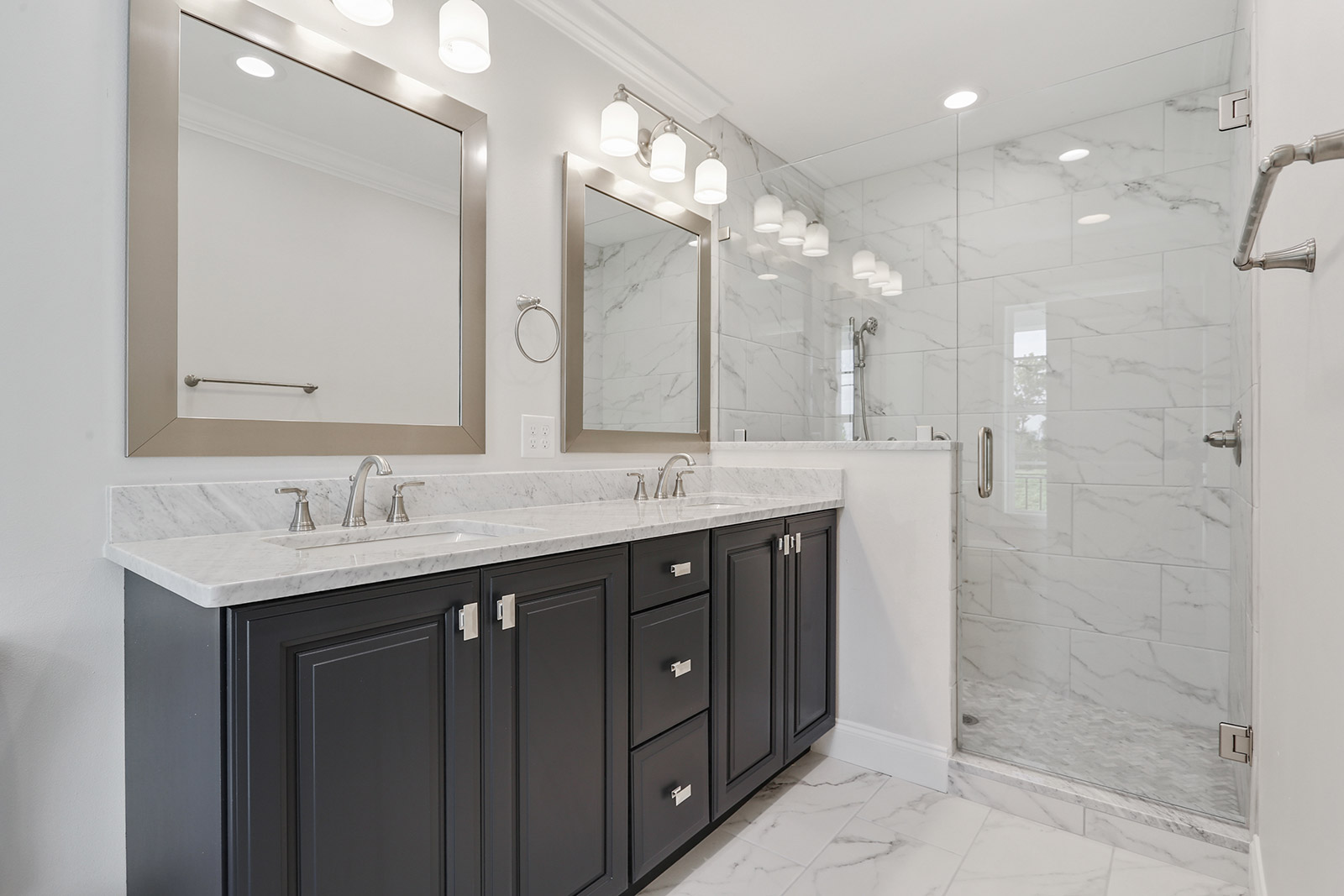 Primary suite bathroom in Patterson House luxury new construction custom home designed and built by DMG