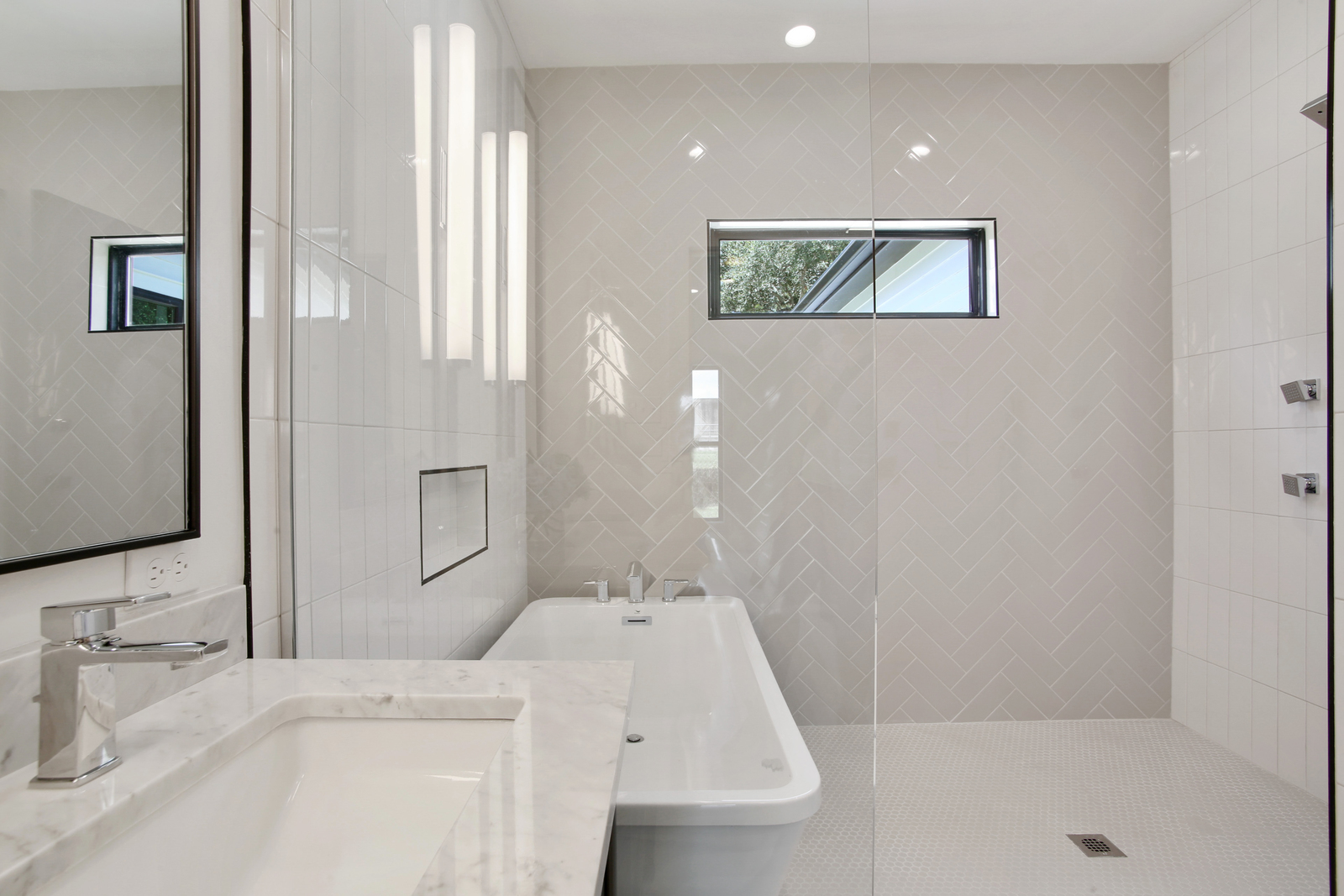 Luxury master bathroom of Pratt House new construction custom home designed and built by DMG Design+Build